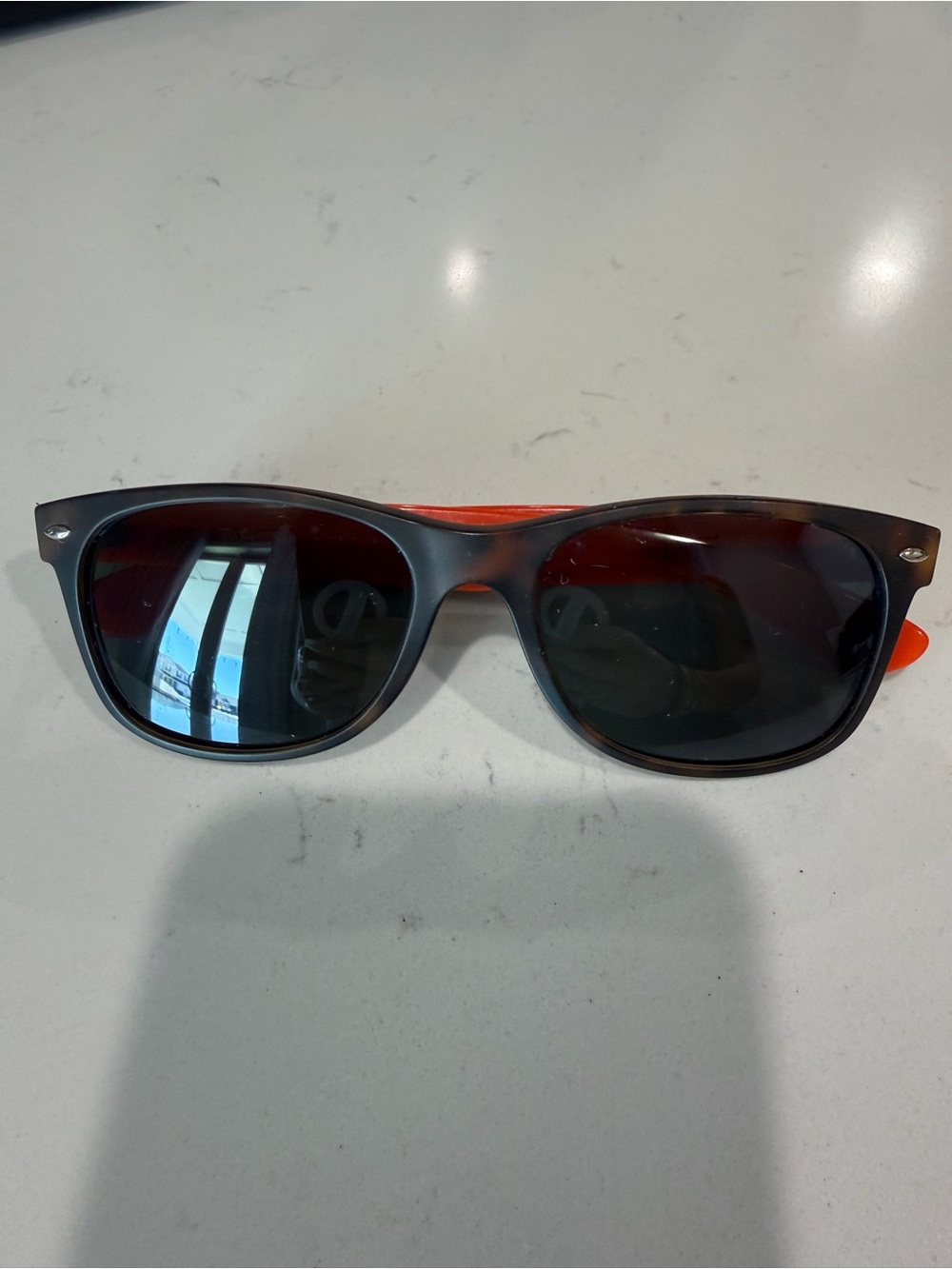 Ray-Ban Wayfarer Sunglasses with Navy/Orange Temples. Tortoiseshell frames.